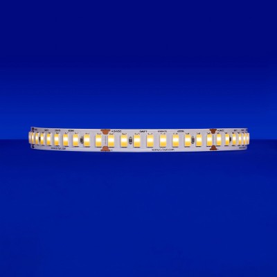 Close-up of the SW-HE+24/6.0 LED strip, emitting a warm 3000K light at 1085 lm/ft, highlighting its 9 diodes within every 2-inch segment
