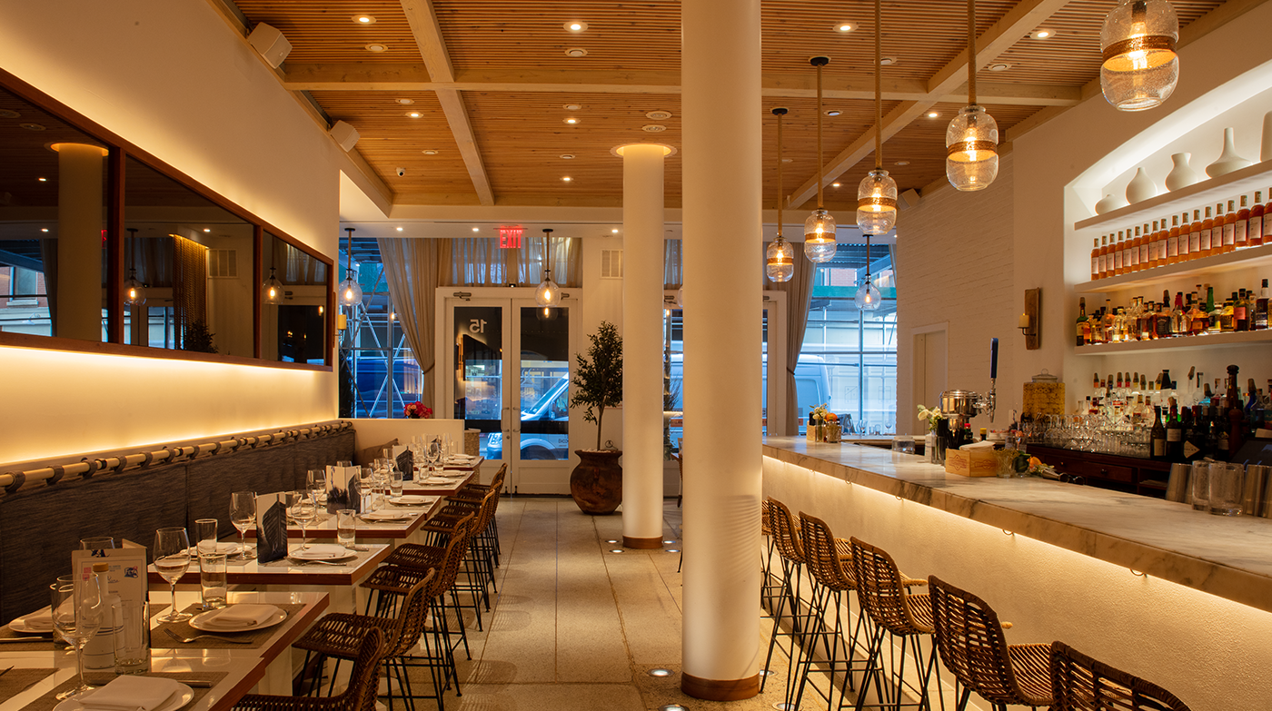 Warm Dim lighting sets the mood in this hip restaurant setting