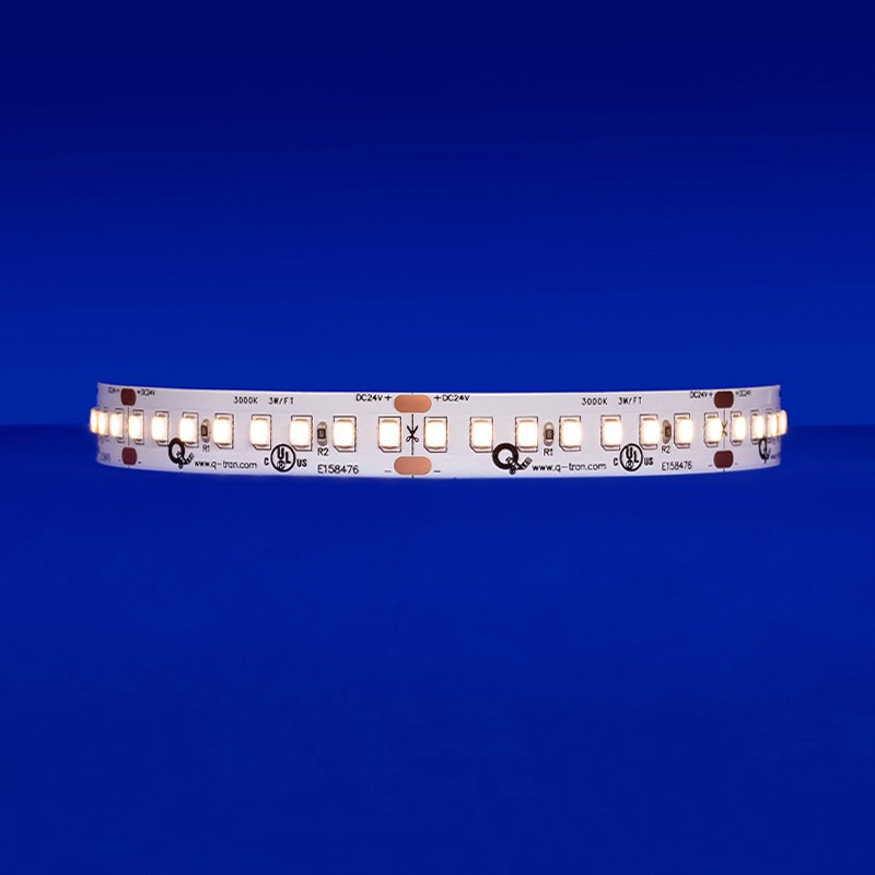 A close-up of the SW-HE24/9.0 LED tape emitting a warm light of 3000K, showcasing its high efficacy with 1159 lm/ft and detail of its 8 diodes within a 2-inch segment